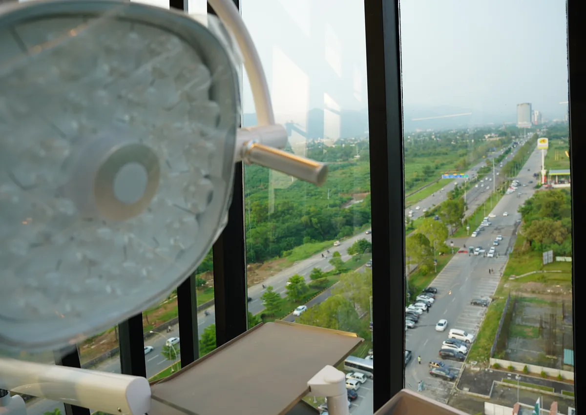 Dental operating light in a treatment room at Tooth Crew Clinic, New Blue Area, Islamabad