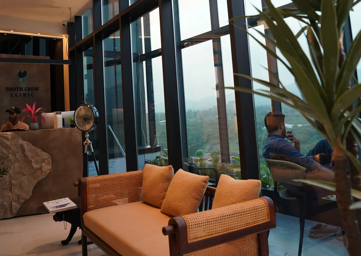 Patient lounge with window seating at Tooth Crew Clinic, New Blue Area, Islamabad