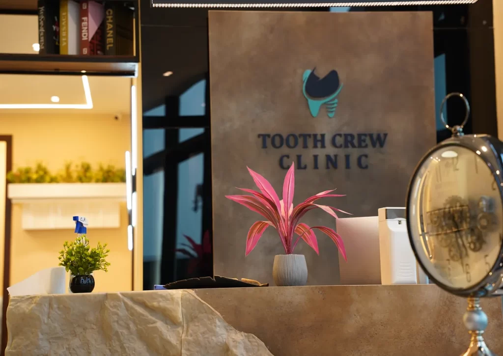Front desk and Tooth Crew Clinic sign at the New Blue Area branch in Islamabad