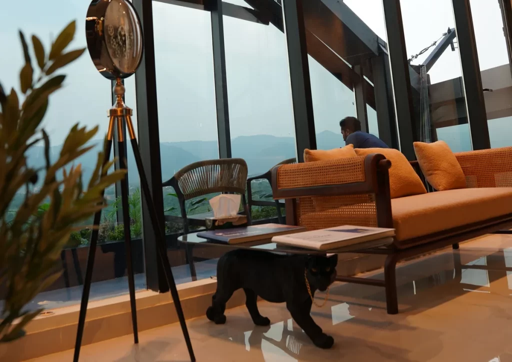Waiting lounge beside the glass facade of Tower 12 at Tooth Crew Clinic, New Blue Area