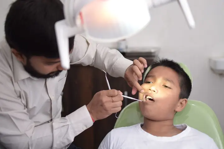 Young boy having a dental check-up in the dental chair